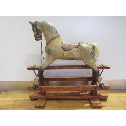 5038 - In the manner of FH Ayres - A Victorian carved wood and gesso rocking horse with original dappled pa... 