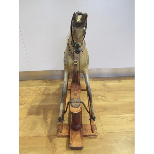 5038 - In the manner of FH Ayres - A Victorian carved wood and gesso rocking horse with original dappled pa... 