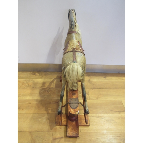 5038 - In the manner of FH Ayres - A Victorian carved wood and gesso rocking horse with original dappled pa... 