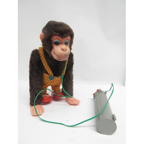 5053 - Two boxed mid 20th Century battery operated toys to include Nomura, Japan, 'Happy Chimp' plush cover... 