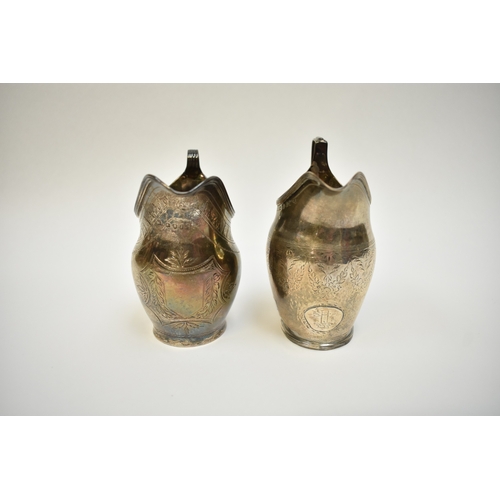 8097 - Two Georgian silver cream jugs, both engraved patterns, one with crest including London 1800 and Lon... 