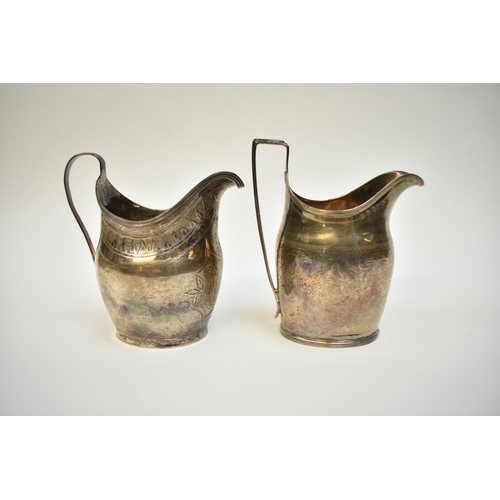 8097 - Two Georgian silver cream jugs, both engraved patterns, one with crest including London 1800 and Lon... 