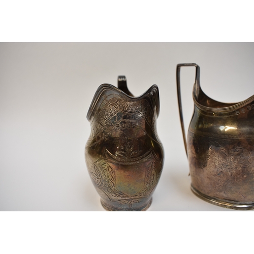 8097 - Two Georgian silver cream jugs, both engraved patterns, one with crest including London 1800 and Lon... 