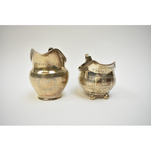 8080 - Two Georgian silver cream jugs including Thomas Wallis II 1806 with monogram to central cartouche. T... 