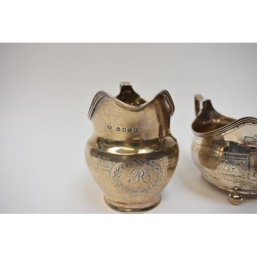 8080 - Two Georgian silver cream jugs including Thomas Wallis II 1806 with monogram to central cartouche. T... 