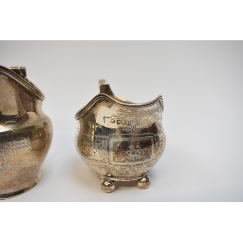 8080 - Two Georgian silver cream jugs including Thomas Wallis II 1806 with monogram to central cartouche. T... 