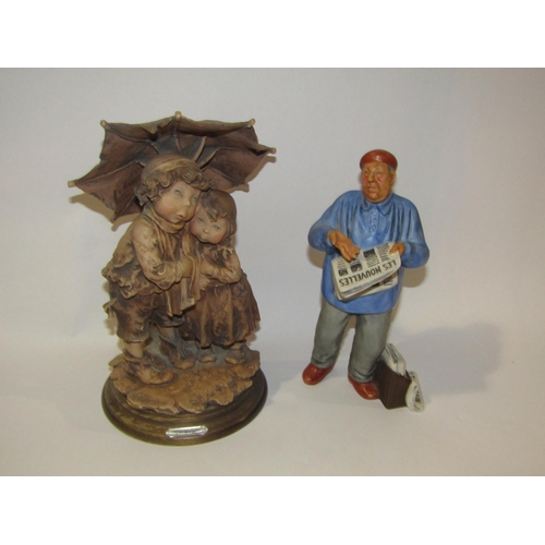 4196 - A Capodimonte figural group depicting two tramps reading newspaper, 32cm tall, a  Gulliver's World r... 