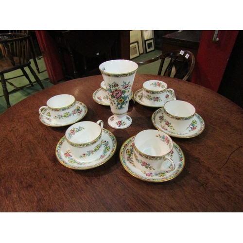 4323 - A set of six Coalport 'Ming Rose' pattern cans and saucers and a matching trumpet form vase