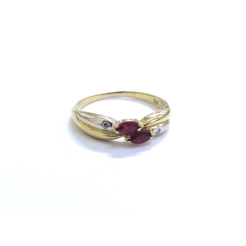 6316 - A ruby and diamond white and yellow gold crossover ring, stamped 750. Size O/P, 2.9g