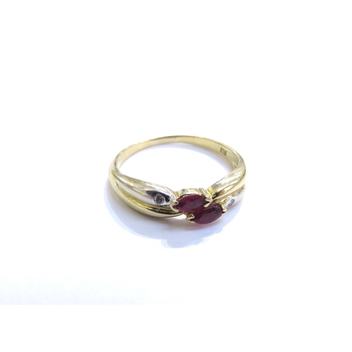 6316 - A ruby and diamond white and yellow gold crossover ring, stamped 750. Size O/P, 2.9g