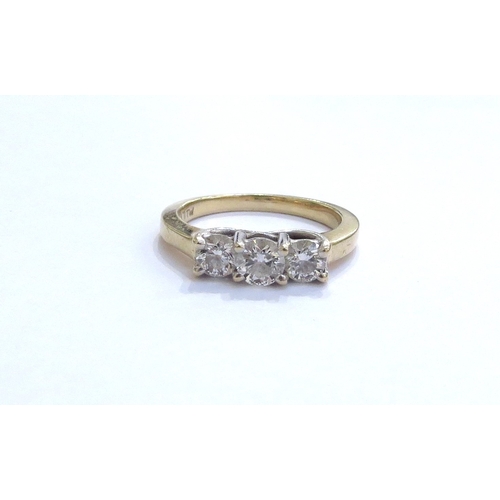 6322 - A three stone diamond ring in stepped mount 0.65ct total approx, stamped 14k. Size O, 4.4g