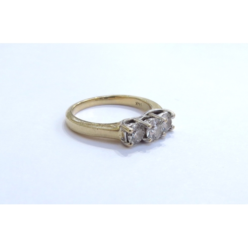 6322 - A three stone diamond ring in stepped mount 0.65ct total approx, stamped 14k. Size O, 4.4g