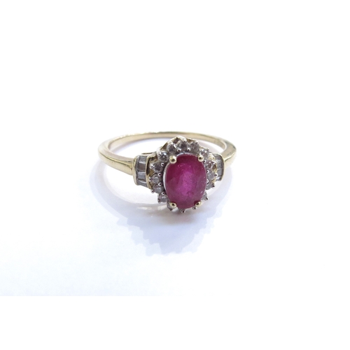 6050 - A ruby and diamond cluster ring, the central oval ruby framed by diamonds with diamond set shoulders... 