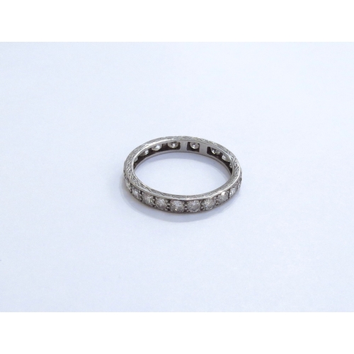 6283 - A diamond eternity ring, unmarked (has been resized). Size S, 3.1g