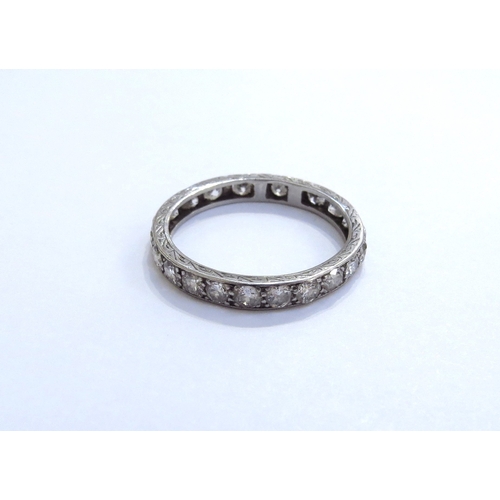 6283 - A diamond eternity ring, unmarked (has been resized). Size S, 3.1g