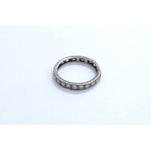 6283 - A diamond eternity ring, unmarked (has been resized). Size S, 3.1g