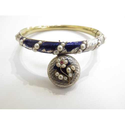 6239 - A 19th Century enamel bangle with pearl inset, hung with a hair panel pendant, enamel damaged/losses... 