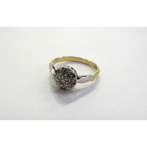 6266 - A diamond cluster ring, stamped 18ct. Size J/K, 2.9g