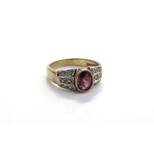 6293 - A 9ct gold ring centrally set with an oval garnet with diamond studded shoulders. Size N/O, 3.6g