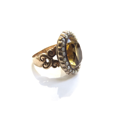 6014 - A Victorian citrine and seed pearl ring with open heart scroll shoulders, unmarked. Size N/O, 7g