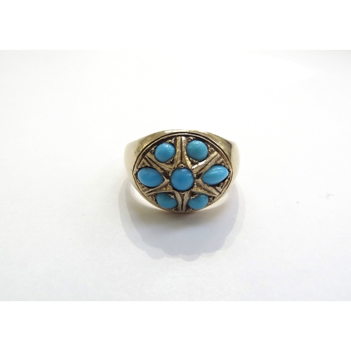 6161 - An unmarked gold ring set with turquoise cabochons. Size M/N, 8.5g