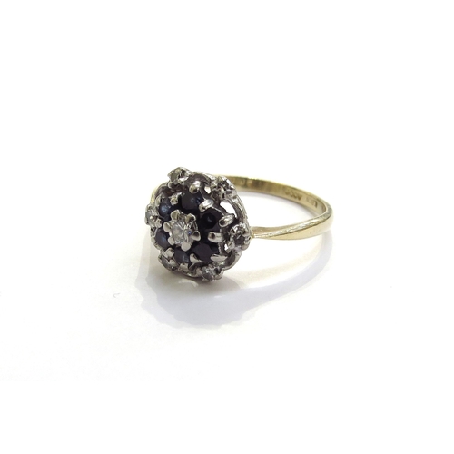 6297 - An 18ct gold sapphire and diamond cluster ring. Size R, 4g