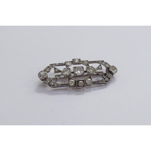 6005 - An Art Deco diamond encrusted brooch the centre diamond 0.50ct approx, unmarked platinum, 4.6cm long... 