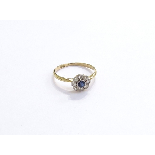 6262 - A sapphire and diamond daisy cluster ring, stamped 18ct/plat. Size L, 1.6g