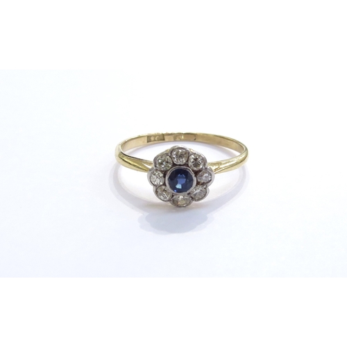 6262 - A sapphire and diamond daisy cluster ring, stamped 18ct/plat. Size L, 1.6g