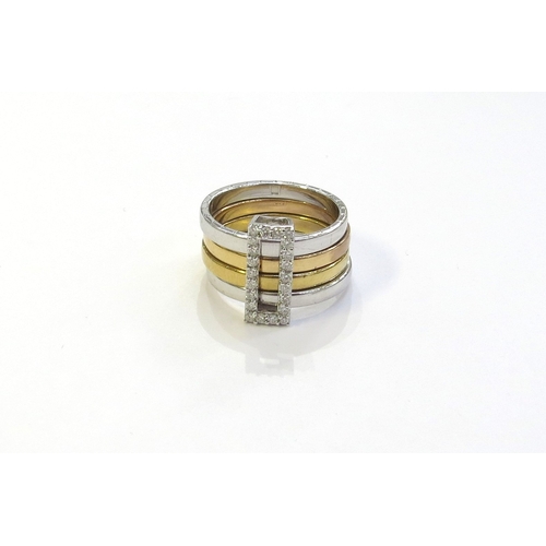 6263 - A tri colour gold ring with four bands, held together with a sliding diamond set buckle, the outer b... 