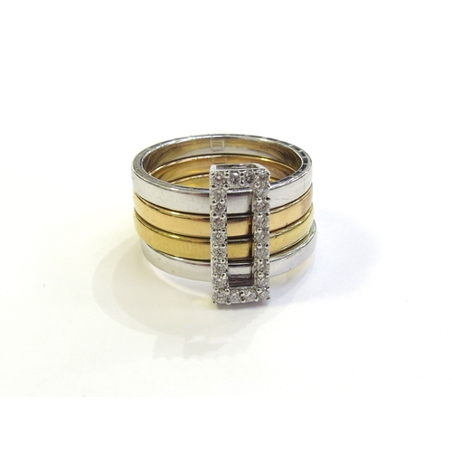 6263 - A tri colour gold ring with four bands, held together with a sliding diamond set buckle, the outer b... 