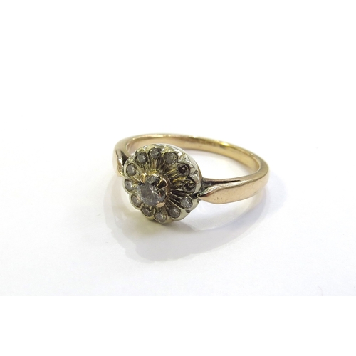 6198 - A diamond cluster ring, stamped 750. Size M, 3.9g