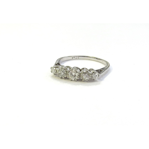 6048 - A white gold five stone graduated diamond ring, stamped 18ct. Size O, 2.2g