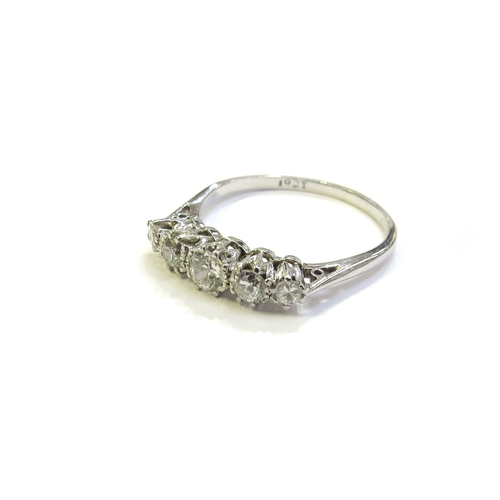 6048 - A white gold five stone graduated diamond ring, stamped 18ct. Size O, 2.2g