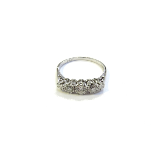 6048 - A white gold five stone graduated diamond ring, stamped 18ct. Size O, 2.2g