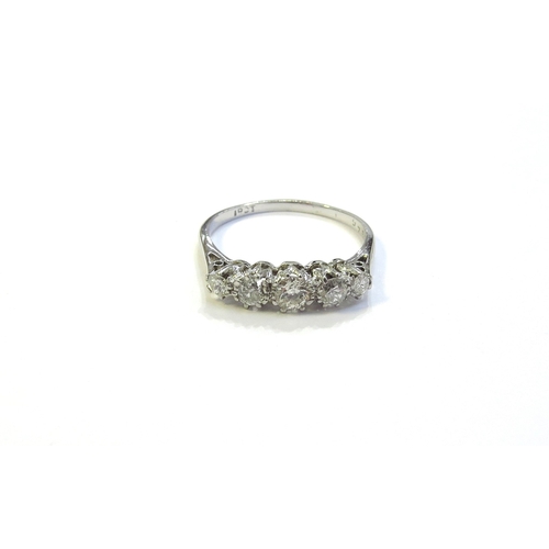 6048 - A white gold five stone graduated diamond ring, stamped 18ct. Size O, 2.2g