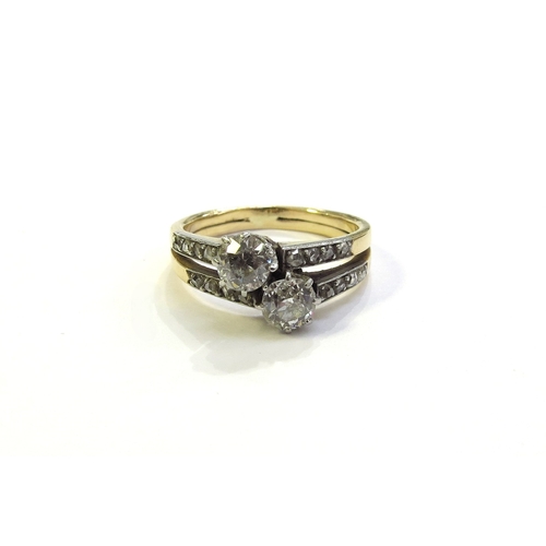 6181 - A double band diamond cross over ring with diamond set shoulders, unmarked gold. Size K, 3.4g