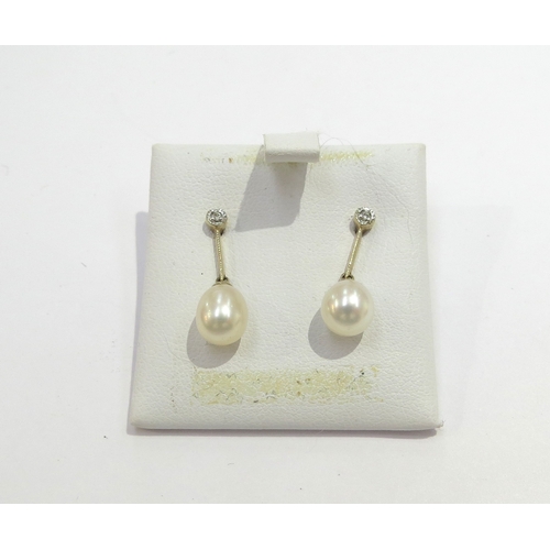 6406 - A pair of 9ct gold pearl drop earrings with diamond set post, 2.3cm drop