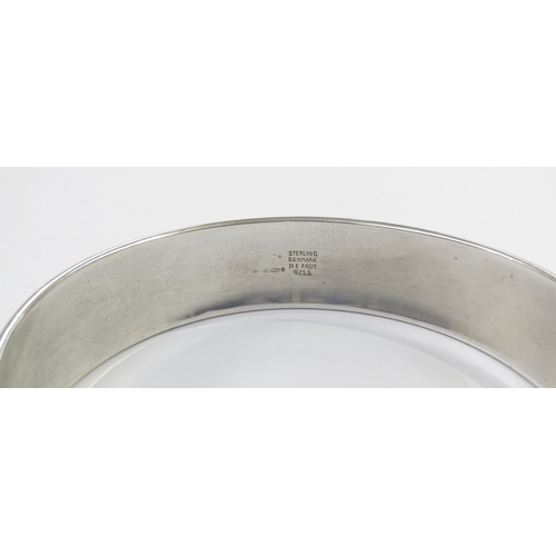 6411 - A Danish silver modernistic bangle by Niels Erik From with a rose quartz to an elliptical shape fron... 