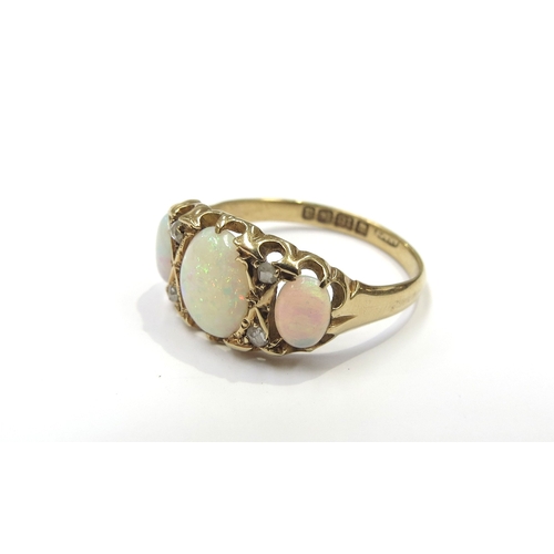 6187 - An 18ct gold opal and diamond ring the three oval opals spaced by old cut diamonds. Size R, 3.6g