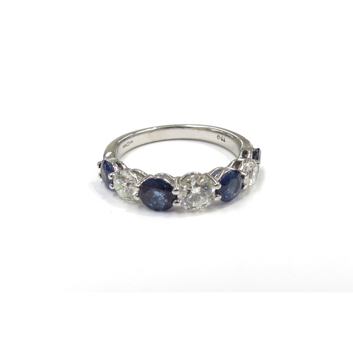 6001 - An 18ct white gold seven stone ring set with alternating sapphires and round cut diamonds. Size P, 4... 