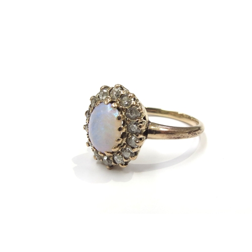 6007 - An opal and diamond cluster ring, shank stamped 14k. Size P, 3.8g