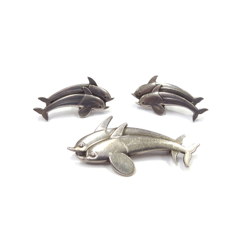 6405 - A Georg Jensen silver double dolphin brooch #317 and a pair of matching earrings #129, boxed