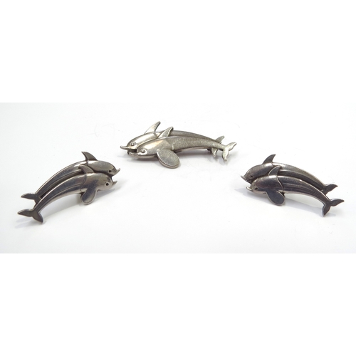 6405 - A Georg Jensen silver double dolphin brooch #317 and a pair of matching earrings #129, boxed