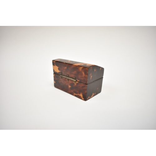 8021 - A late 18th Century tortoiseshell lady's writing case with hinged cover, revealing an inset mirror, ... 