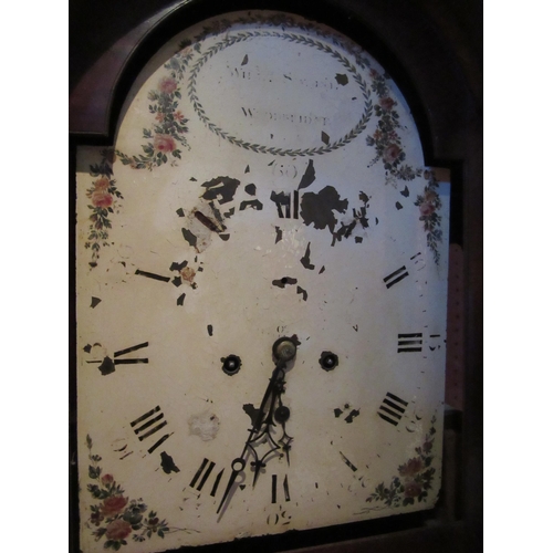 4039 - A Georgian mahogany grandfather clock with worn arch top dial, Woodbridge maker with weights and pen... 