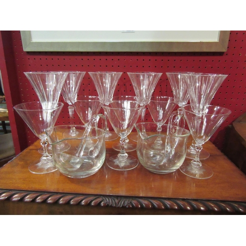 4051 - Two sets of six cocktail glasses and a pair of punch jugs with ladles