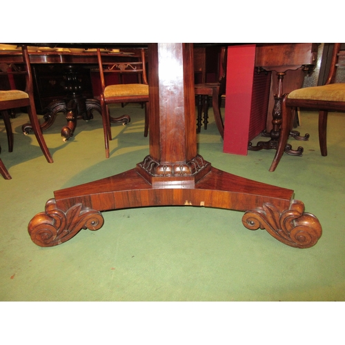 4052 - A Regency rosewood breakfast table on single pedestal base, acanthus scrolled leaf feet, split to to... 