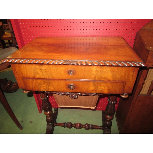 4057 - Circa 1840, a flame mahogany sewing table the internal mirror rising lid with key and fitted interio... 