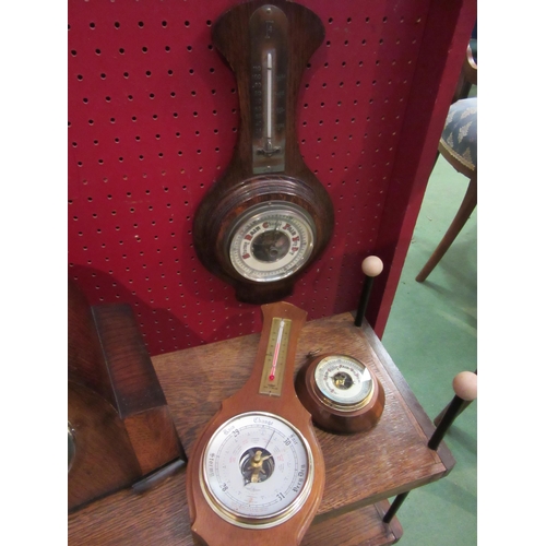 4072 - A mantel clock, two wall barometers with temperature gauges and one other (4)